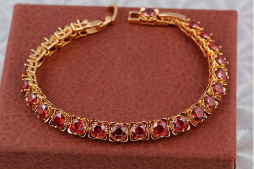 Браслет Xuping Jewelry з червоними каменями по всій довжині 17 см 6 мм золотистий