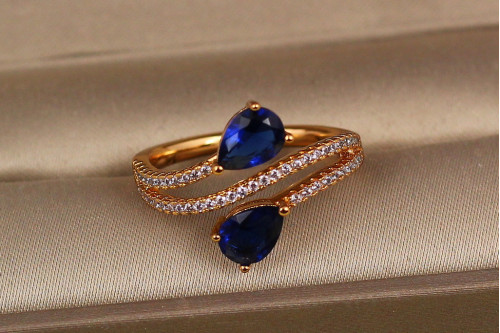 Кільце Xuping Jewelry зустрічні краплі із синіми каменями р 19 золотисте