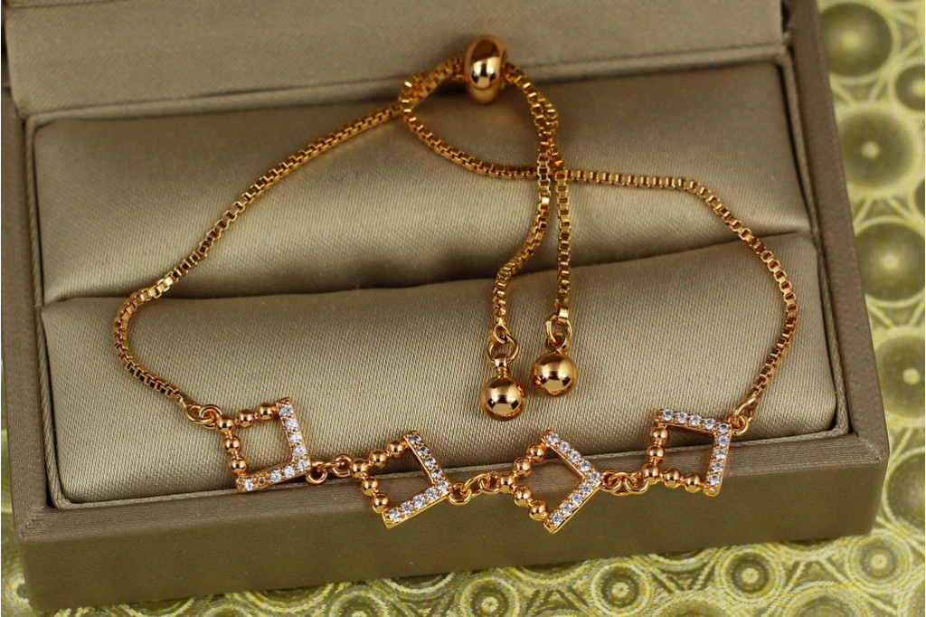 Браслет Xuping Jewelry регулируемый дружные ромбики на бегунке золотистый