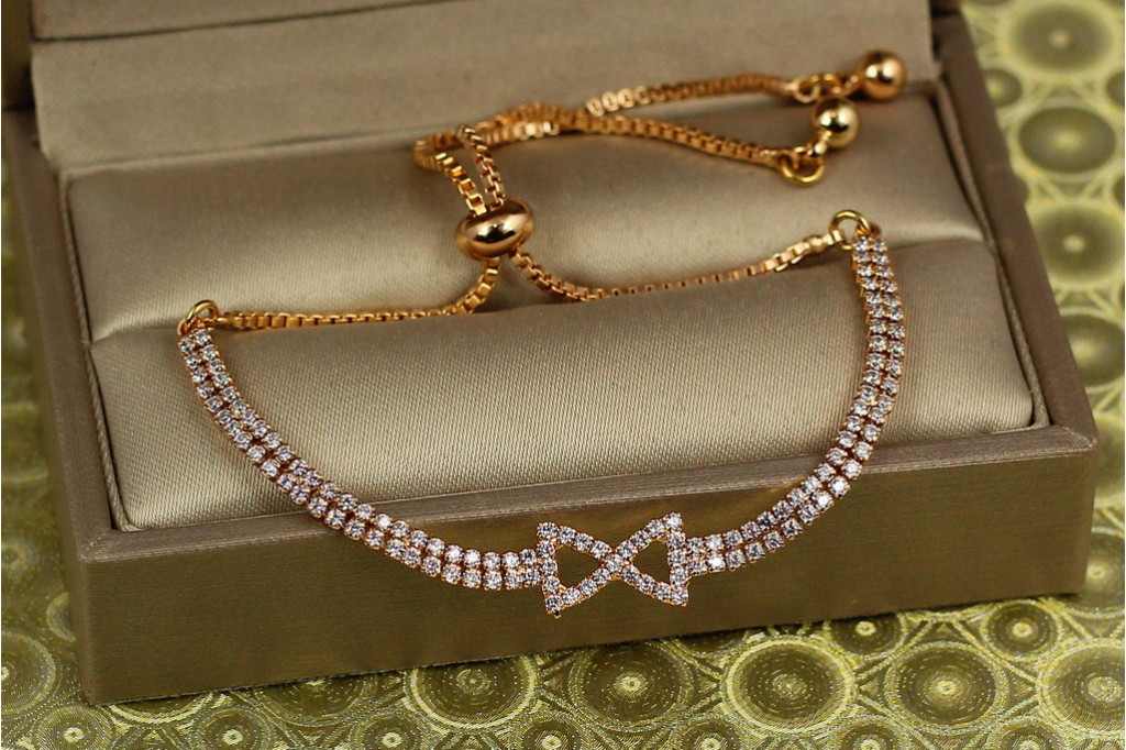 Браслет Xuping Jewelry регулируемый две дорожки с бантиком на бегунке золотистый