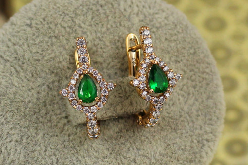 Сережки Xuping Jewelry Капелька із зеленим каменем в обідку з шипами 2 см золотисті