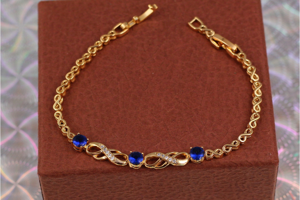 Браслет Xuping Jewelry вісімки з трьома круглими синіми каменями у центрі 21 см 6 мм золотистий