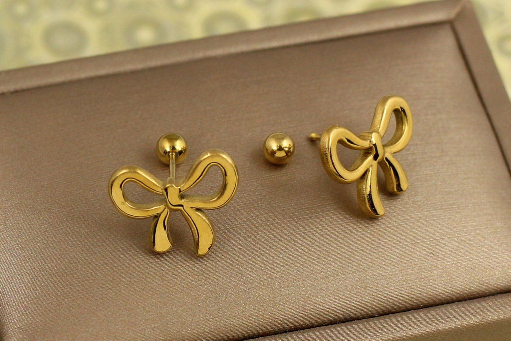 Серьги гвоздики Xuping Jewelry бантик на закрутке лимонные
