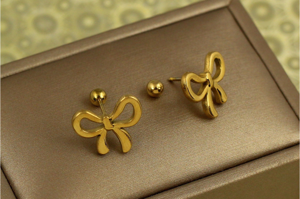 Серьги гвоздики Xuping Jewelry бантик на закрутке лимонные
